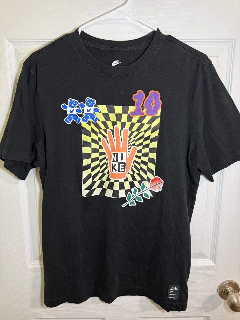 Nike Black Short-Sleeve Tee with Multicolor Graphic Hand and Checker Motif